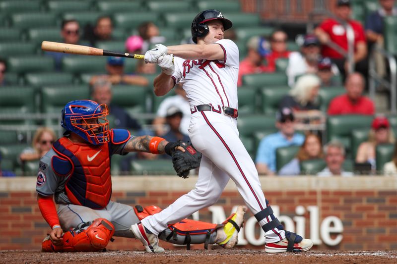 Sep 30, 2024; Atlanta, Georgia, USA; Atlanta Braves left fielder Jarred Kelenic (24) hits a single against the New York Mets in the eighth inning at Truist Park. Mandatory Credit: Brett Davis-Imagn Images