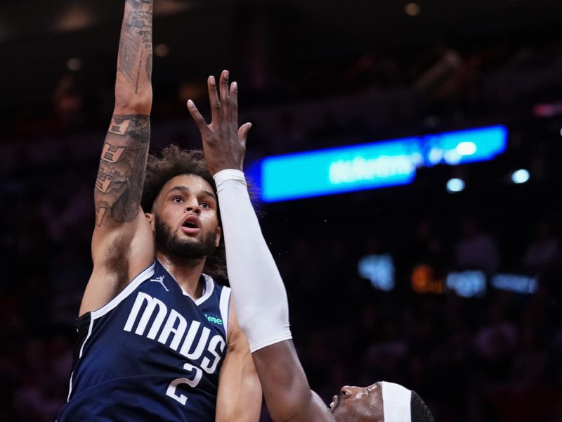 MIAMI, FLORIDA - NOVEMBER 24: Dereck Lively II #2 of the Dallas Mavericks goes up for a shot against Bam Adebayo #13 of the Miami Heat during the first quarter at Kaseya Center on November 24, 2024 in Miami, Florida. NOTE TO USER: User expressly acknowledges and agrees that, by downloading and or using this photograph, User is consenting to the terms and conditions of the Getty Images License Agreement. (Photo by Rich Storry/Getty Images)