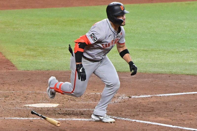Sep 23, 2024; Phoenix, Arizona, USA;  San Francisco Giants outfielder Michael Conforto (8) doubles in the seventh inning against the Arizona Diamondbacks at Chase Field. Mandatory Credit: Matt Kartozian-Imagn Images