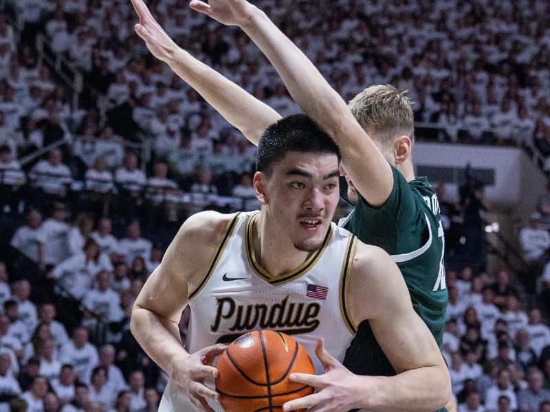 Jan 29, 2023; West Lafayette, Indiana, USA; Purdue Boilermakers center Zach Edey (15) shoots the ball while Michigan State Spartans center Carson Cooper (15) defends in the second half at Mackey Arena. Mandatory Credit: Trevor Ruszkowski-USA TODAY Sports