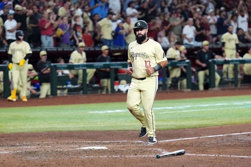 Aug 31, 2024; Phoenix, Arizona, USA; Arizona Diamondbacks second base Luis Guillorme (13) scoes a run against the Los Angeles Dodgers during the seventh inning at Chase Field. Mandatory Credit: Joe Camporeale-USA TODAY Sports