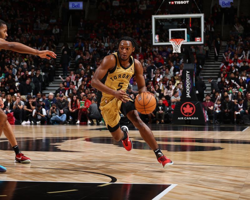 TORONTO, CANADA - APRIL 7: Immanuel Quickley #5 of the Toronto Raptors dribbles the ball during the game against the Washington Wizards on April 7, 2024 at the Scotiabank Arena in Toronto, Ontario, Canada.  NOTE TO USER: User expressly acknowledges and agrees that, by downloading and or using this Photograph, user is consenting to the terms and conditions of the Getty Images License Agreement.  Mandatory Copyright Notice: Copyright 2024 NBAE (Photo by Vaughn Ridley/NBAE via Getty Images)