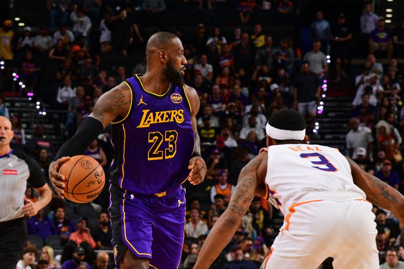 PHOENIX, AZ - OCTOBER 28: LeBron James #23 of the Los Angeles Lakers handles the ball during the game against the Phoenix Suns on October 28, 2024 at Footprint Center in Phoenix, Arizona. NOTE TO USER: User expressly acknowledges and agrees that, by downloading and or using this photograph, user is consenting to the terms and conditions of the Getty Images License Agreement. Mandatory Copyright Notice: Copyright 2024 NBAE (Photo by Kate Frese/NBAE via Getty Images)