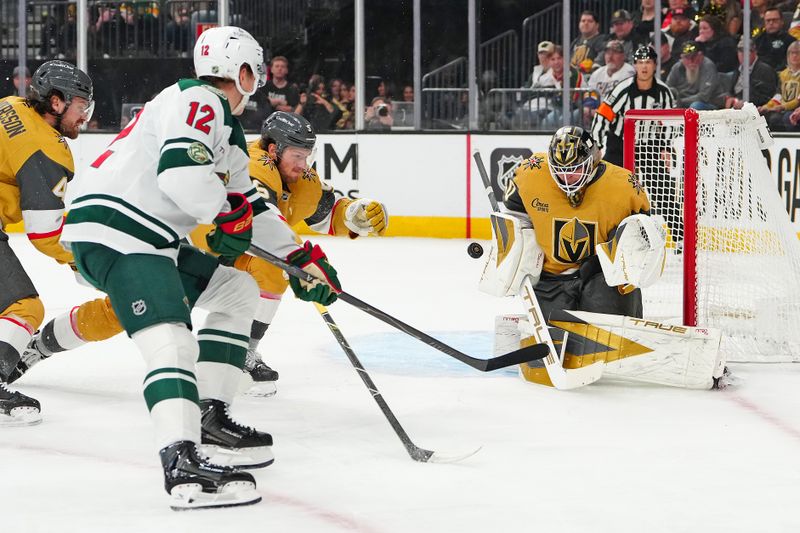 Mar 6, 2026; Las Vegas, Nevada, USA; Vegas Golden Knights goaltender Akira Schmid (40) makes a save against Minnesota Wild left wing Matt Boldy (12) during the first period at T-Mobile Arena. Mandatory Credit: Stephen R. Sylvanie-Imagn Images