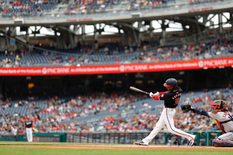 Apr 21, 2024; Washington, District of Columbia, USA; Washington Nationals shortstop CJ Abrams (5) singles against the Houston Astros during the first inning at Nationals Park. Mandatory Credit: Geoff Burke-USA TODAY Sports