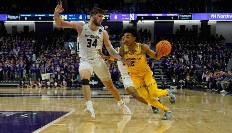 Feb 2, 2023; Evanston, Illinois, USA;Northwestern Wildcats center Matthew Nicholson (34) defends Michigan Wolverines guard Kobe Bufkin (2) during the first half at Welsh-Ryan Arena. Mandatory Credit: David Banks-USA TODAY Sports