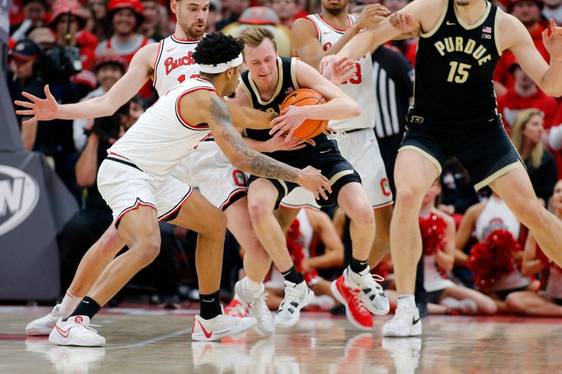 Feb 18, 2024; Columbus, Ohio, USA;  Purdue Boilermakers guard Braden Smith (3) fights for the ball with Ohio State Buckeyes guard Roddy Gayle Jr. (1) during the second half at Value City Arena. Mandatory Credit: Joseph Maiorana-USA TODAY Sports