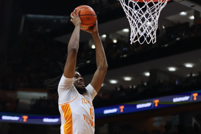 Jan 6, 2024; Knoxville, Tennessee, USA; Tennessee Volunteers forward Jonas Aidoo (0) dunks the ball against the Mississippi Rebels during the first half at Thompson-Boling Arena at Food City Center. Mandatory Credit: Randy Sartin-USA TODAY Sports