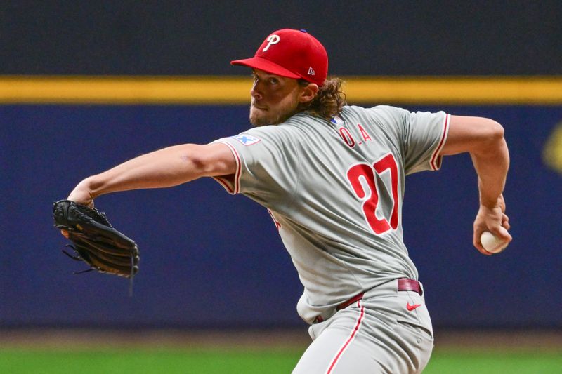 Sep 18, 2024; Milwaukee, Wisconsin, USA; Philadelphia Phillies starting pitcher Aaron Nola (27) pitches in the first inning against the Milwaukee Brewers at American Family Field. Mandatory Credit: Benny Sieu-Imagn Images