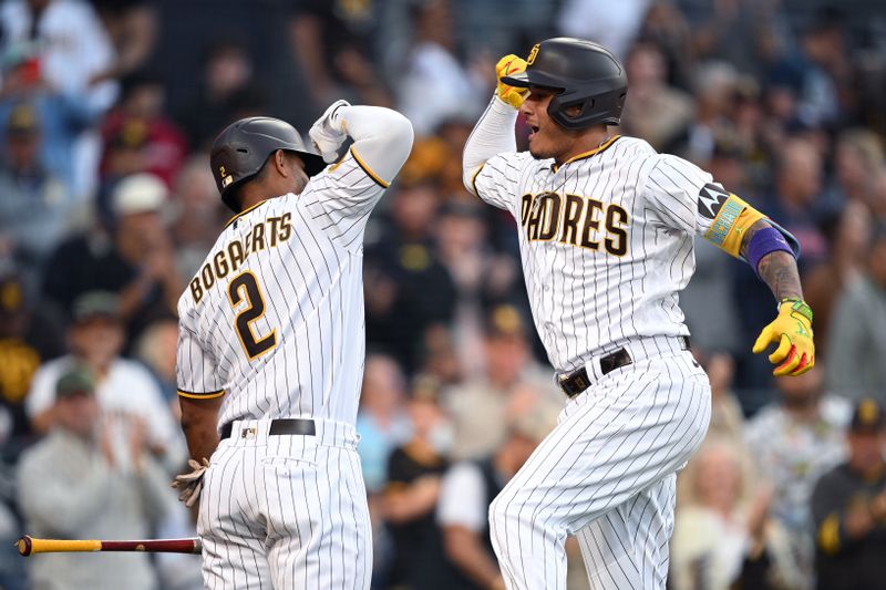 Jul 5, 2023; San Diego, California, USA; San Diego Padres third baseman Manny Machado (right) celebrates with  designated hitter Xander Bogaerts (2) after hitting a home run against the Los Angeles Angels during the sixth inning at Petco Park. Mandatory Credit: Orlando Ramirez-USA TODAY Sports