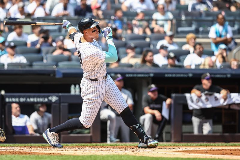 Aug 25, 2024; Bronx, New York, USA;  New York Yankees center fielder Aaron Judge (99) hits a two run home run in the first inning against the Colorado Rockies at Yankee Stadium. Mandatory Credit: Wendell Cruz-USA TODAY Sports