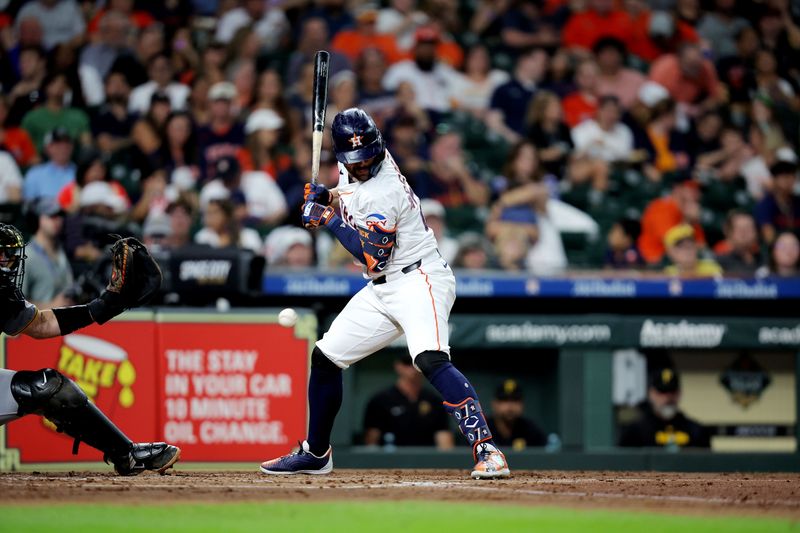 Jul 31, 2024; Houston, Texas, USA; Houston Astros right fielder Chas McCormick (20) is hit by a pitch delivered by Pittsburgh Pirates starting pitcher Jake Woodford (not pictured) during the third inning at Minute Maid Park. Mandatory Credit: Erik Williams-USA TODAY Sports