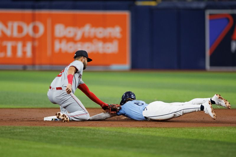 Jun 30, 2024; St. Petersburg, Florida, USA;  Tampa Bay Rays shortstop Taylor Walls (6) is caught stealing by Washington Nationals second base Luis Garcia Jr. (2) in the second inning at Tropicana Field. Mandatory Credit: Nathan Ray Seebeck-USA TODAY Sports