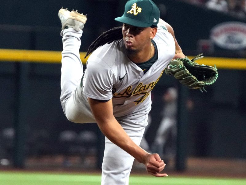 Jun 29, 2024; Phoenix, Arizona, USA; Oakland Athletics pitcher Osvaldo Bido (45) throws against the Arizona Diamondbacks in the eighth inning at Chase Field. Mandatory Credit: Rick Scuteri-USA TODAY Sports