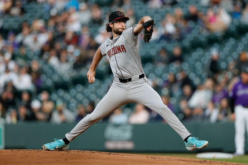 Apr 8, 2024; Denver, Colorado, USA; Arizona Diamondbacks starting pitcher Zac Gallen (23) pitches in the first inning against the Colorado Rockies at Coors Field. Mandatory Credit: Isaiah J. Downing-USA TODAY Sports