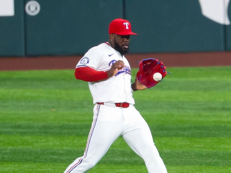 Aug 6, 2024; Arlington, Texas, USA; Texas Rangers right fielder Adolis Garcia (53) fields a ball during the fourth inning against the Houston Astros at Globe Life Field. Mandatory Credit: Kevin Jairaj-USA TODAY Sports
