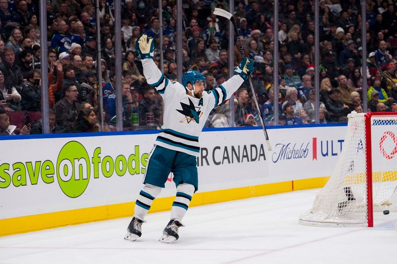 Dec 23, 2023; Vancouver, British Columbia, CAN; San Jose Sharks defenseman Mario Ferraro (38) celebrates a goal scored by forward Fabian Zetterlund (20) against the Vancouver Canucks in the second period at Rogers Arena. Mandatory Credit: Bob Frid-USA TODAY Sports