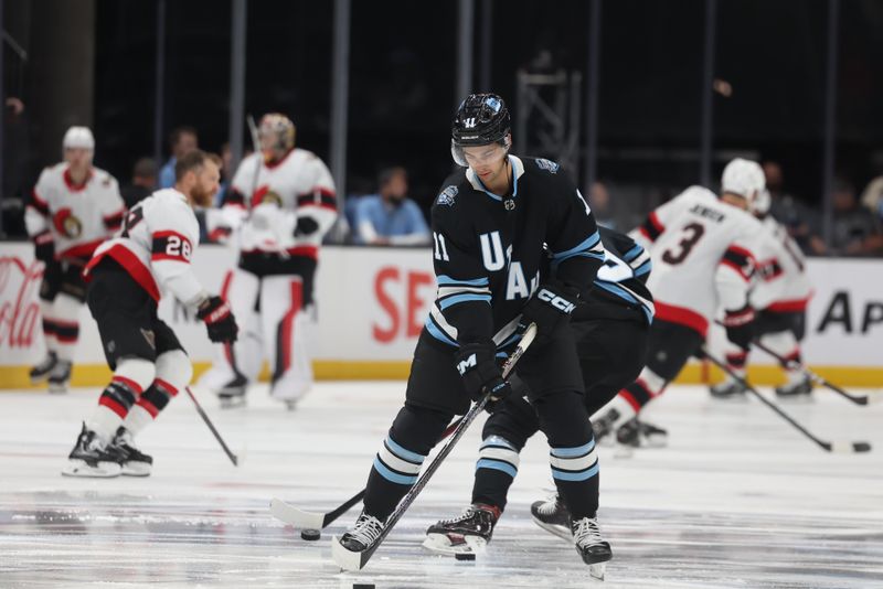 Oct 22, 2024; Salt Lake City, Utah, USA; Utah Hockey Club right wing Dylan Guenther (11) warms up before a game against the Ottawa Senators at Delta Center. Mandatory Credit: Rob Gray-Imagn Images