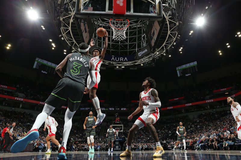 MINNEAPOLIS, MN -  APRIL 2: Amen Thompson #1 of the Houston Rockets grabs a rebound during the game against the Minnesota Timberwolves  on April 2, 2024 at Target Center in Minneapolis, Minnesota. NOTE TO USER: User expressly acknowledges and agrees that, by downloading and or using this Photograph, user is consenting to the terms and conditions of the Getty Images License Agreement. Mandatory Copyright Notice: Copyright 2024 NBAE (Photo by David Sherman/NBAE via Getty Images)