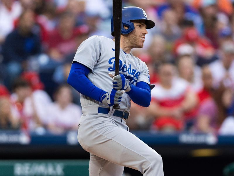 Jun 9, 2023; Philadelphia, Pennsylvania, USA; Los Angeles Dodgers first baseman Freddie Freeman (5) hits a double during the first inning against the Philadelphia Phillies at Citizens Bank Park. Mandatory Credit: Bill Streicher-USA TODAY Sports