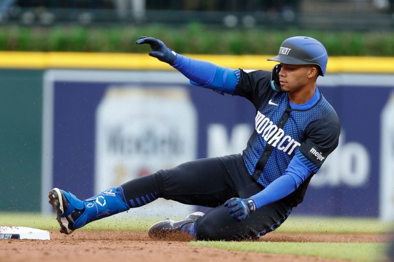 May 11, 2024; Detroit, Michigan, USA; Detroit Tigers outfielder Wenceel Pérez (46) slides into second base against the Houston Astros during the second inning at Comerica Park. Mandatory Credit: Brian Bradshaw Sevald-USA TODAY Sports