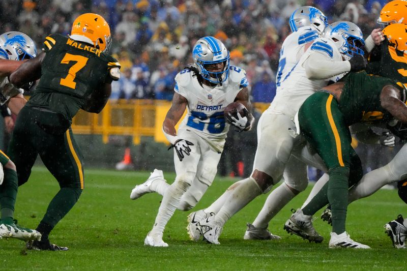 Detroit Lions running back Jahmyr Gibbs (26) runs for a touchdown during the second half of an NFL football game against the Green Bay Packers, Sunday, Nov. 3, 2024, in Green Bay, Wis. (AP Photo/Morry Gash)