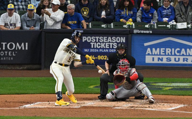 Sep 28, 2023; Milwaukee, Wisconsin, USA; Milwaukee Brewers outfielder Garrett Mitchell (5) hits a double against the St. Louis Cardinals in the fourth inning at American Family Field. Mandatory Credit: Michael McLoone-USA TODAY Sports