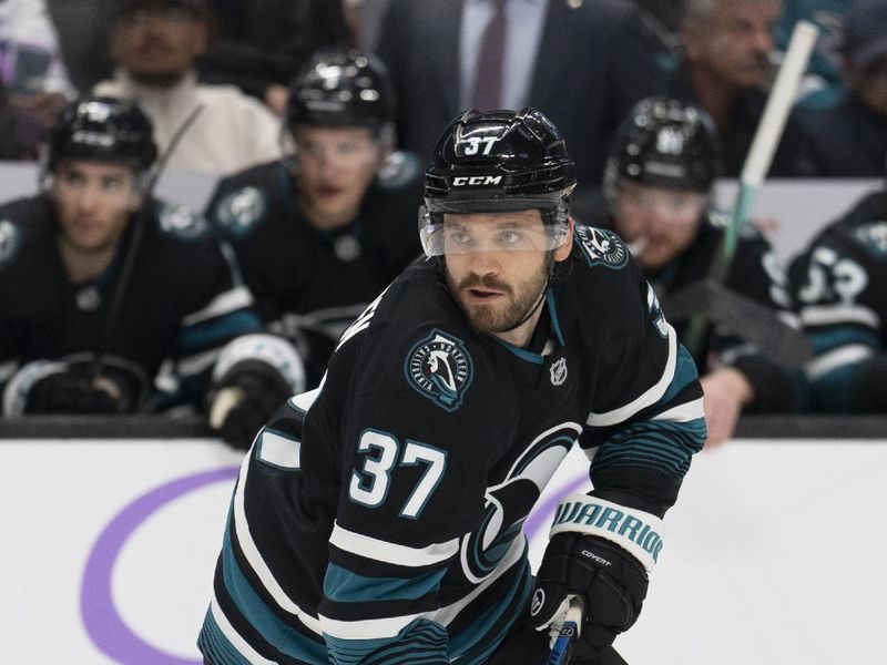 Nov 7, 2024; San Jose, California, USA;  San Jose Sharks defenseman Timothy Liljegren (37) controls the puck during the second period against the Minnesota Wild at SAP Center at San Jose. Mandatory Credit: Stan Szeto-Imagn Images