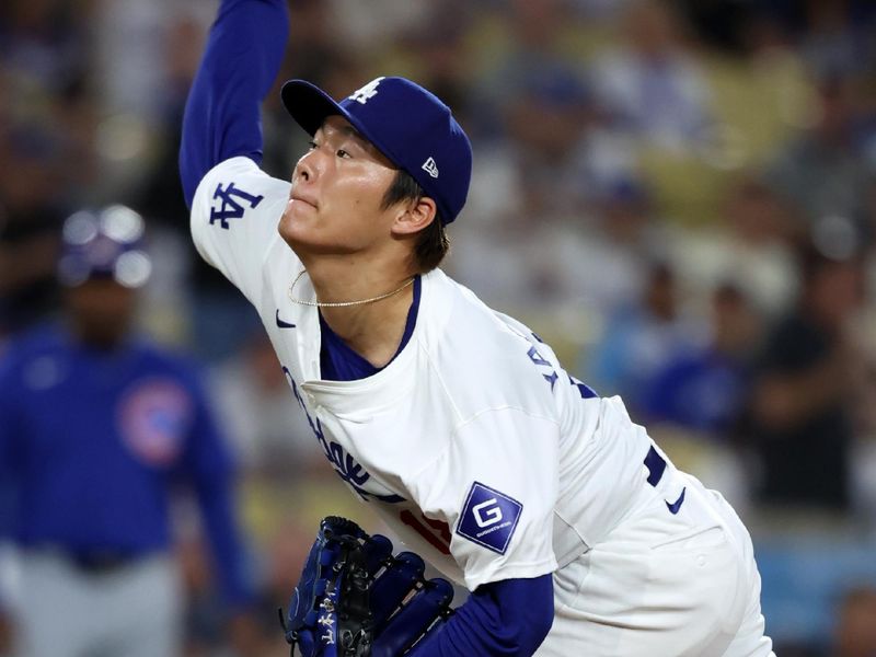 Sep 10, 2024; Los Angeles, California, USA;  Los Angeles Dodgers starting pitcher Yoshinobu Yamamoto (18) pitches during the first inning against the Chicago Cubs at Dodger Stadium. Mandatory Credit: Kiyoshi Mio-Imagn Images