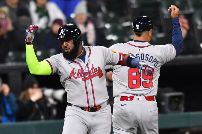 Apr 2, 2024; Chicago, Illinois, USA; Atlanta Braves designated hitter Marcell Ozuna (20) celebrates his solo home run with third base coach Matt Tuiasosopo (89) during the seventh inning against the Chicago White Sox at Guaranteed Rate Field. Mandatory Credit: Patrick Gorski-USA TODAY Sports