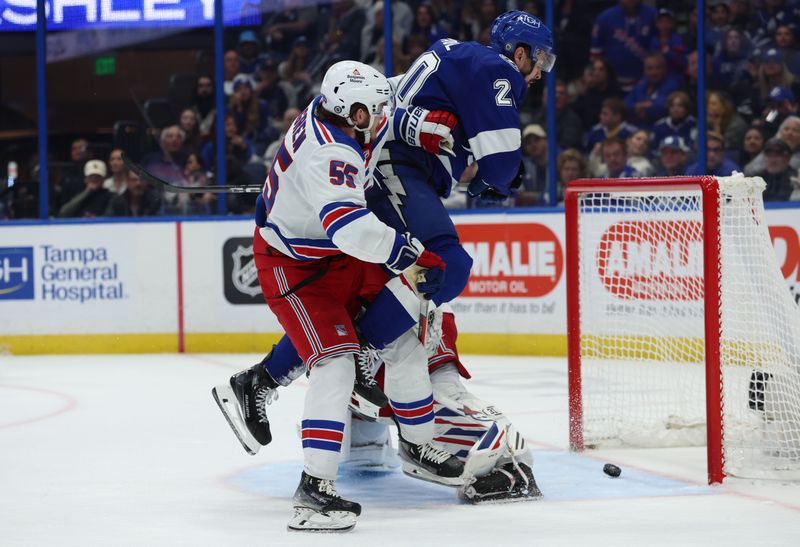 Dec 30, 2023; Tampa, Florida, USA; Tampa Bay Lightning left wing Nicholas Paul (20) shoots as New York Rangers goaltender Igor Shesterkin (31) and defenseman Ryan Lindgren (55) defend during the third period at Amalie Arena. Mandatory Credit: Kim Klement Neitzel-USA TODAY Sports