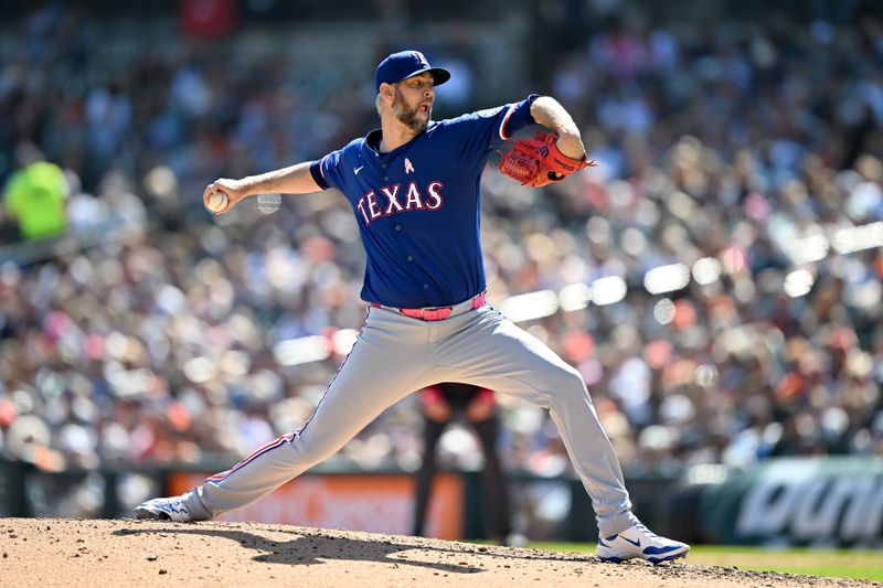 May 11, 2025; Detroit, Michigan, USA; Texas Rangers pitcher Chris Martin (55) throws a pitch against the Detroit Tigers in the eighth inning at Comerica Park. Mandatory Credit: Lon Horwedel-Imagn Images
