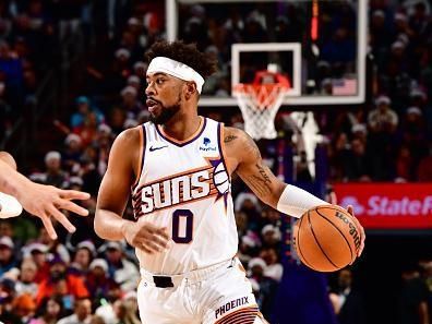 PHOENIX, AZ - DECEMBER 25: Jordan Goodwin #0 of the Phoenix Suns handles the ball during the game against the Dallas Mavericks on December 25, 2023 at Footprint Center in Phoenix, Arizona. NOTE TO USER: User expressly acknowledges and agrees that, by downloading and or using this photograph, user is consenting to the terms and conditions of the Getty Images License Agreement. Mandatory Copyright Notice: Copyright 2023 NBAE (Photo by Barry Gossage/NBAE via Getty Images)