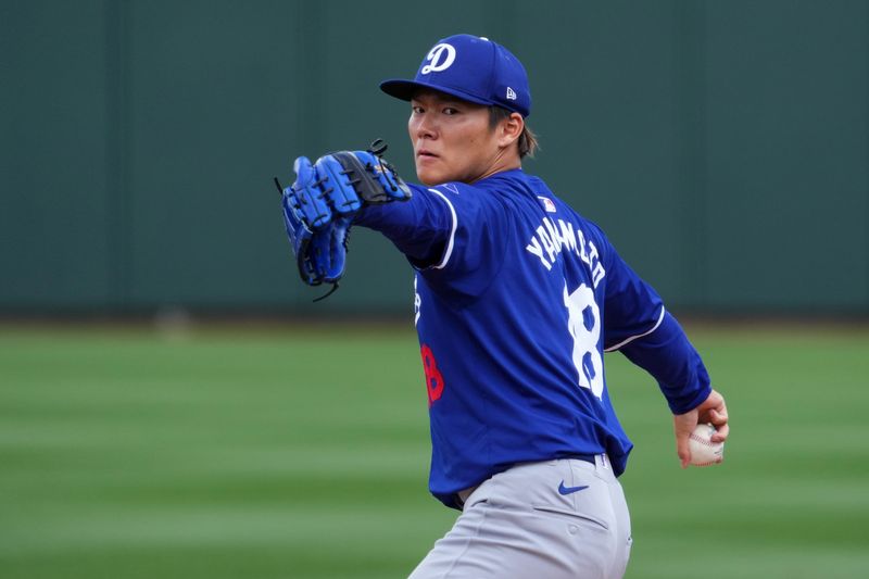 Feb 28, 2024; Surprise, Arizona, USA; Los Angeles Dodgers starting pitcher Yoshinobu Yamamoto (18) pitches during the third inning against the Texas Rangers at Surprise Stadium. Mandatory Credit: Joe Camporeale-USA TODAY Sports