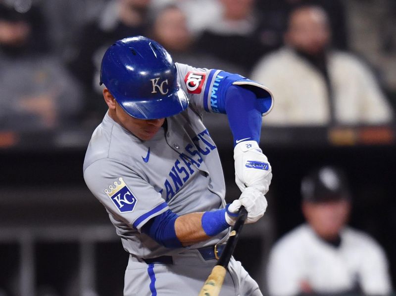 Apr 15, 2024; Chicago, Illinois, USA; Kansas City Royals catcher Freddy Fermin (34) singles during the ninth inning against the Chicago White Sox at Guaranteed Rate Field. Mandatory Credit: Patrick Gorski-USA TODAY Sports