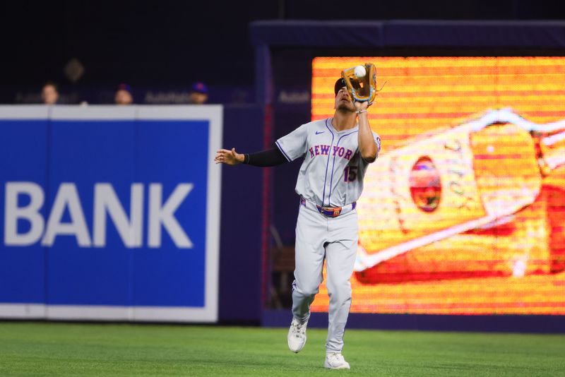 Jul 21, 2024; Miami, Florida, USA; New York Mets right fielder Tyrone Taylor (15) catches a fly ball to retire Miami Marlins catcher Nick Fortes (not pictured) during the second inning at loanDepot Park. Mandatory Credit: Sam Navarro-USA TODAY Sports