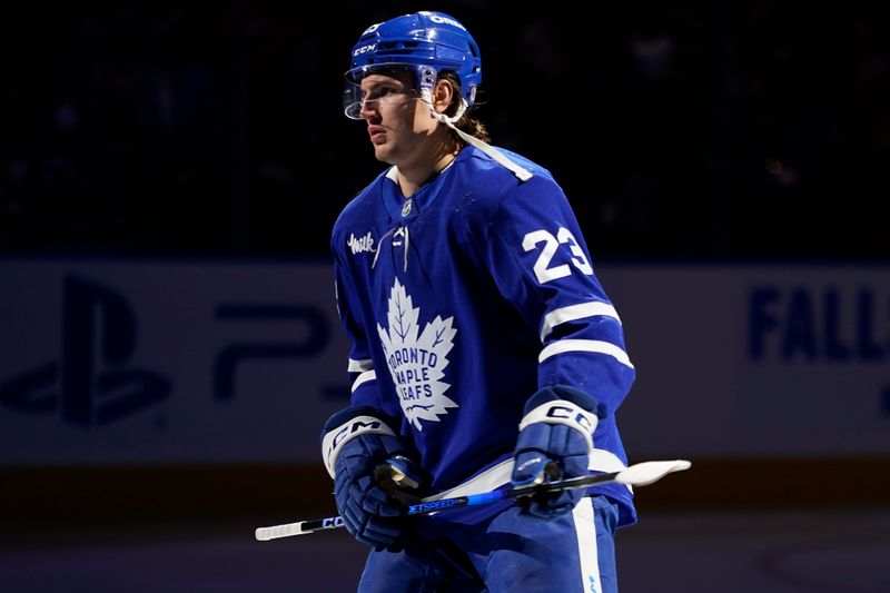 Nov 8, 2024; Toronto, Ontario, CAN; Toronto Maple Leafs forward Matthew Knies (23) skates during the player introductions before a game against the Detroit Red Wings  at Scotiabank Arena. Mandatory Credit: John E. Sokolowski-Imagn Images