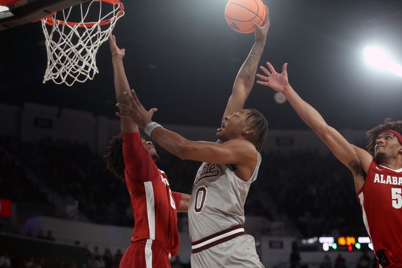 Jan 13, 2026; Starkville, Mississippi, USA; Mississippi State Bulldogs forward Jamarion Davis-Fleming (0) dunks as Alabama Crimson Tide forward London Jemison (6) and forward Amari Allen (5) defend during the first half at Humphrey Coliseum. Mandatory Credit: Petre Thomas-Imagn Images