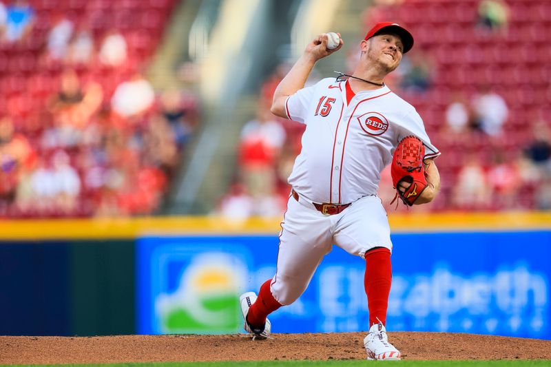 Aug 14, 2024; Cincinnati, Ohio, USA; Cincinnati Reds starting pitcher Emilio Pagan (15) pitches against the St. Louis Cardinals in the second inning at Great American Ball Park. Mandatory Credit: Katie Stratman-USA TODAY Sports