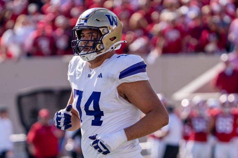 Oct 26, 2024; Bloomington, Indiana, USA; Washington Huskies offensive lineman Drew Azzopardi (74) runs to the sideline during the third quarter against the Indiana Hoosiers at Memorial Stadium. Mandatory Credit: Jacob Musselman-Imagn Images