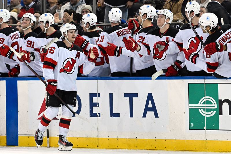 Dec 2, 2024; New York, New York, USA;  New Jersey Devils center Jack Hughes (86) celebrates his goal against the New York Rangers with teammates during the second period at Madison Square Garden. Mandatory Credit: Dennis Schneidler-Imagn Images