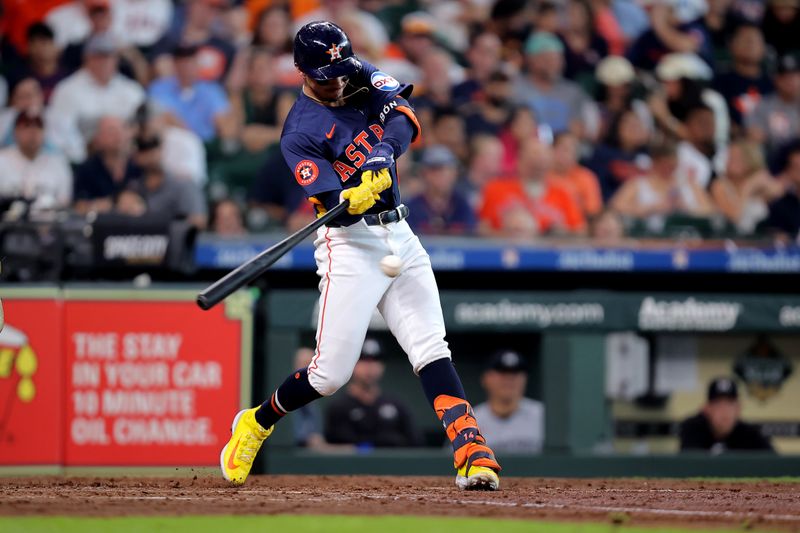 Jun 1, 2024; Houston, Texas, USA; Houston Astros left fielder Mauricio Dubon (14) hits a single against the Minnesota Twins during the sixth inning at Minute Maid Park. Mandatory Credit: Erik Williams-USA TODAY Sports