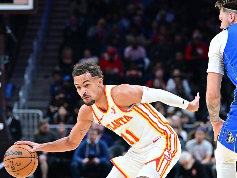 ATLANTA, GA - JANUARY 26: Trae Young #11 of the Atlanta Hawks handles the ball during the game against the Dallas Mavericks on January 26, 2024 at State Farm Arena in Atlanta, Georgia.  NOTE TO USER: User expressly acknowledges and agrees that, by downloading and/or using this Photograph, user is consenting to the terms and conditions of the Getty Images License Agreement. Mandatory Copyright Notice: Copyright 2024 NBAE (Photo by Adam Hagy/NBAE via Getty Images)