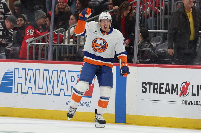 Nov 10, 2025; Newark, New Jersey, USA; New York Islanders center Mathew Barzal (13) celebrates his game winning goal against the New Jersey Devils during overtime at Prudential Center. Mandatory Credit: Ed Mulholland-Imagn Images