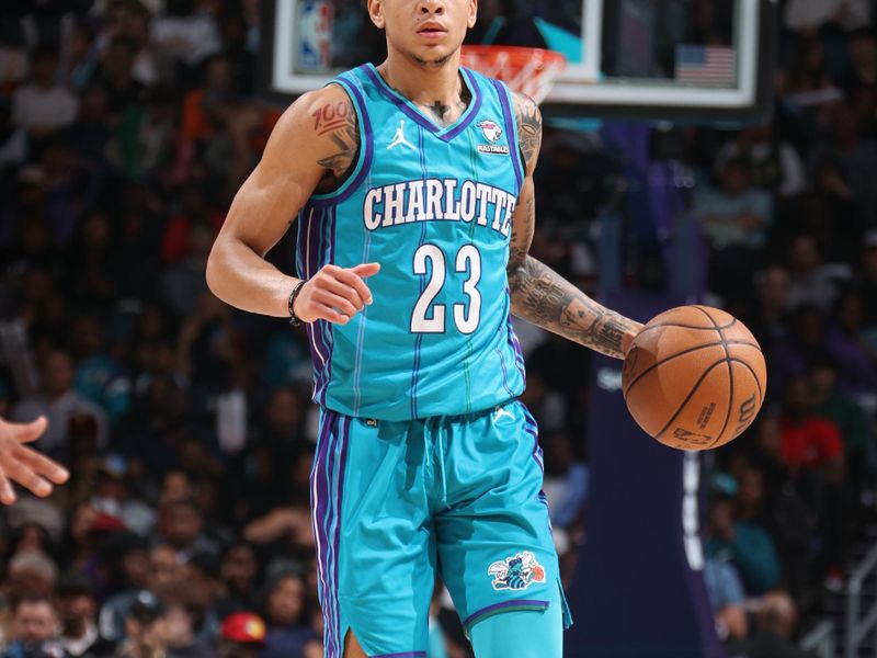 CHARLOTTE, NC - MARCH 15:  Tre Mann #23 of the  Charlotte Hornets handles the ball during the game  on March 15, 2024 at Spectrum Center in Charlotte, North Carolina. NOTE TO USER: User expressly acknowledges and agrees that, by downloading and or using this photograph, User is consenting to the terms and conditions of the Getty Images License Agreement.  Mandatory Copyright Notice:  Copyright 2024 NBAE (Photo by Nathaniel S. Butler/NBAE via Getty Images)