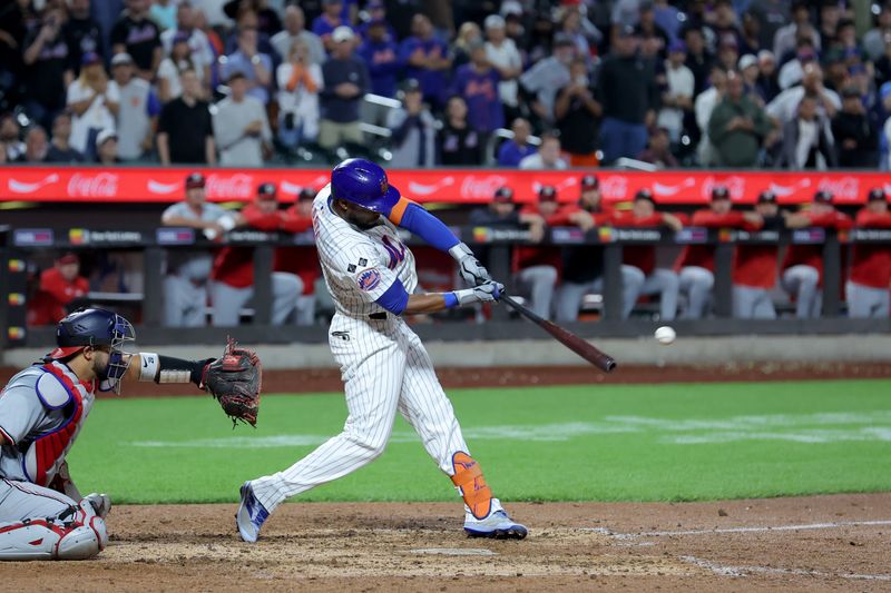 Sep 16, 2024; New York City, New York, USA; New York Mets right fielder Starling Marte (6) hits a tenth inning walkoff single against the Washington Nationals at Citi Field. Mandatory Credit: Brad Penner-Imagn Images