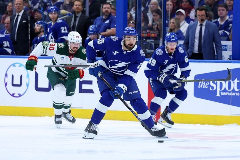 Mar 24, 2026; Tampa, Florida, USA; Tampa Bay Lightning left wing Nick Paul (20) controls the puck against the Minnesota Wild in the first period at Benchmark International Arena. Mandatory Credit: Nathan Ray Seebeck-Imagn Images