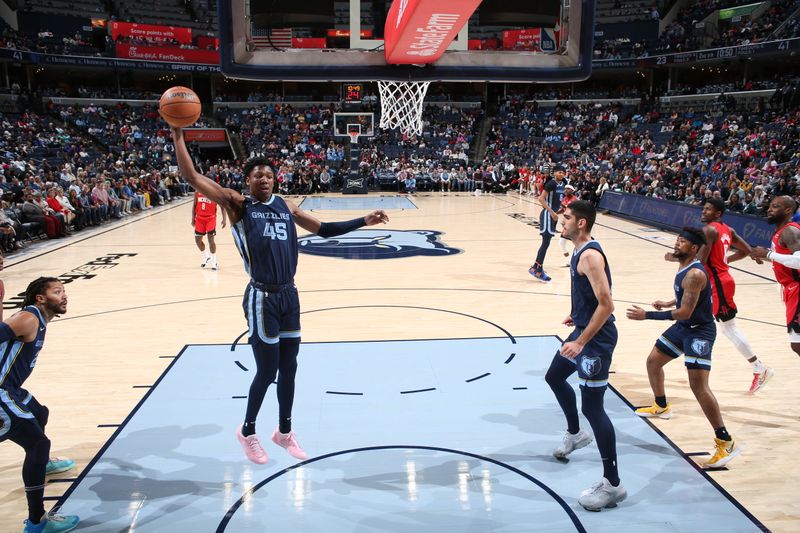 MEMPHIS, TN - FEBRUARY 14: GG Jackson #45 of the Memphis Grizzlies grabs a rebound during the game against the Houston Rockets on February 14, 2024 at FedExForum in Memphis, Tennessee. NOTE TO USER: User expressly acknowledges and agrees that, by downloading and or using this photograph, User is consenting to the terms and conditions of the Getty Images License Agreement. Mandatory Copyright Notice: Copyright 2024 NBAE (Photo by Joe Murphy/NBAE via Getty Images)