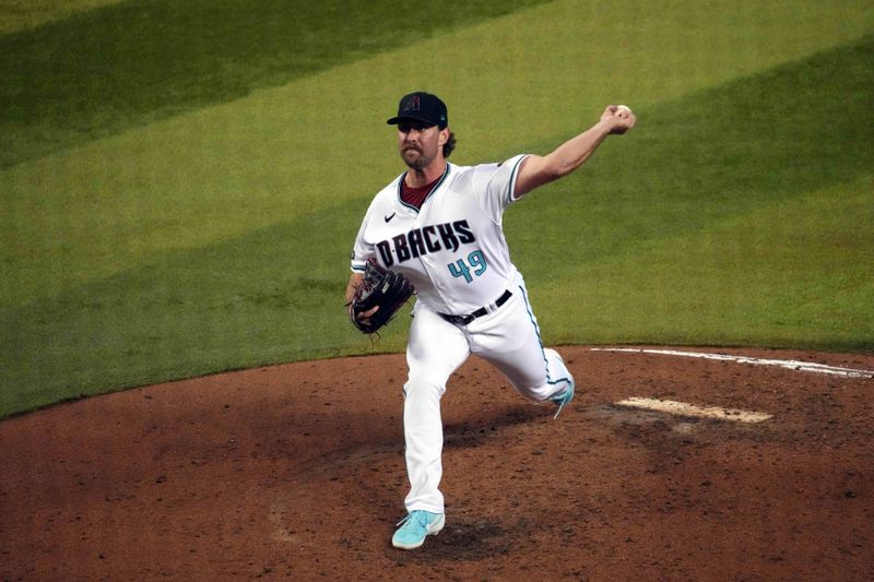 Jul 30, 2023; Phoenix, Arizona, USA; Arizona Diamondbacks relief pitcher Tyler Gilbert (49) pitches against the Seattle Mariners during the sixth inning at Chase Field. Mandatory Credit: Joe Camporeale-USA TODAY Sports