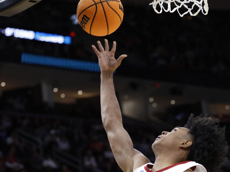 Mar 21, 2025; Cleveland, OH, USA; Alabama Crimson Tide guard Aden Holloway (2) shoots the ball in the second half during the NCAA Tournament First Round at Rocket Arena. Mandatory Credit: Rick Osentoski-Imagn Images